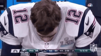 A Man Wearing A Patriots Jersey With The Number 12 On The Back GIF