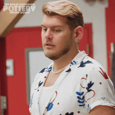 A Man Wearing A Pearl Necklace Is Featured On The Great Canadian Pottery Throw Down Show GIF