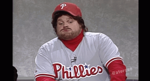 A Man Wearing A Phillies Jersey And A Red Cap GIF