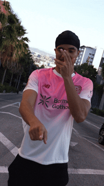 A Man Wearing A Pink And White Shirt That Says Barma Gothac On It GIF