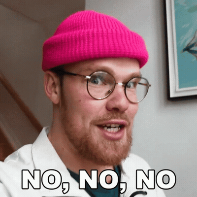 A Man Wearing A Pink Beanie And Glasses Says No GIF