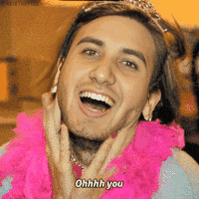 A Man Wearing A Pink Boa And A Tiara Says Ohhh You GIF