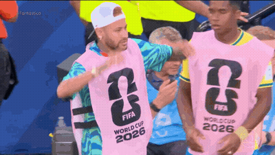A Man Wearing A Pink Fifa World Cup 2026 Vest GIF