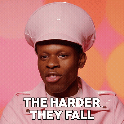 A Man Wearing A Pink Hat And A Pink Jacket With The Words The Harder They Fall Below Him GIF