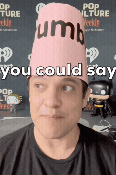 A Man Wearing A Pink Hat That Says " You Could Say " On It GIF