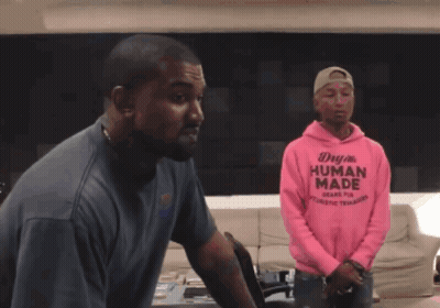 A Man Wearing A Pink Hoodie That Says Human Made On It GIF