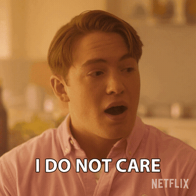 A Man Wearing A Pink Shirt Says I Do Not Care GIF