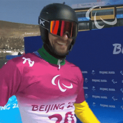 A Man Wearing A Pink Shirt That Says Beijing GIF
