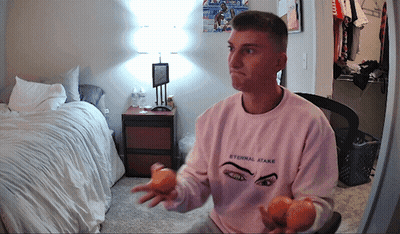 A Man Wearing A Pink Shirt That Says Eternal State GIF