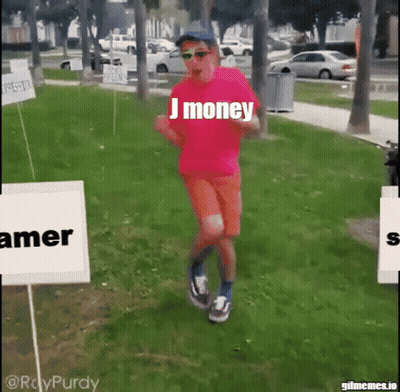 A Man Wearing A Pink Shirt That Says J Money Is Running In A Park GIF