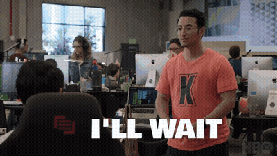 A Man Wearing A Pink Shirt With The Letter K On It GIF