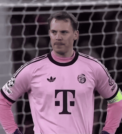 A Man Wearing A Pink T-Mobile Jersey Stands In Front Of A Goal GIF