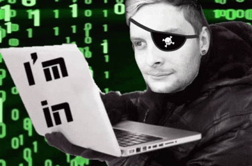 A Man Wearing A Pirate Eye Patch Holds A Laptop And A Piece Of Paper That Says I 'M In GIF