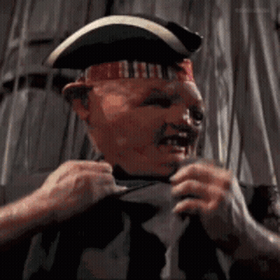 A Man Wearing A Pirate Hat Is Pulling His Shirt Up GIF