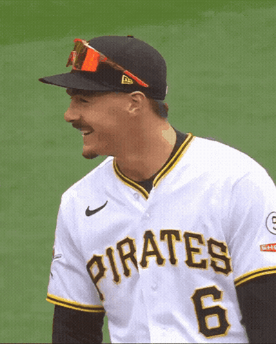 A Man Wearing A Pirates Jersey And Sunglasses Smiles GIF