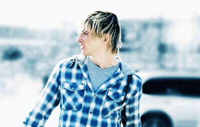 A Man Wearing A Plaid Shirt And A Grey T-Shirt GIF