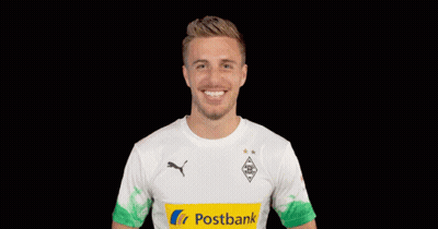 A Man Wearing A Postbank Shirt Making A Heart Shape With His Hands GIF