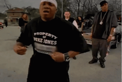 A Man Wearing A Property Of Mike Jones Shirt GIF
