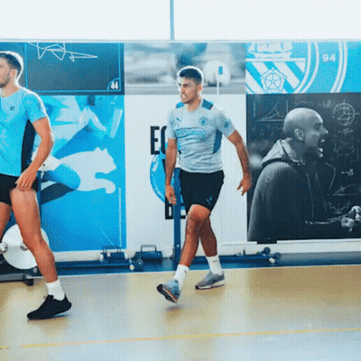 A Man Wearing A Puma Jersey Is Walking On A Basketball Court GIF