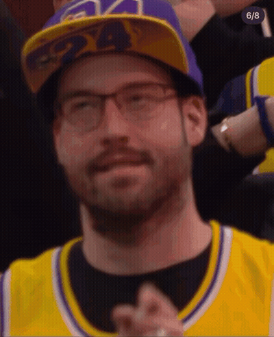 A Man Wearing A Purple 24 Hat And Glasses GIF