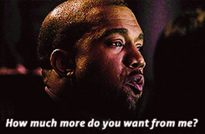 A Man Wearing A Purple Jacket With A Mamba Logo On The Front GIF