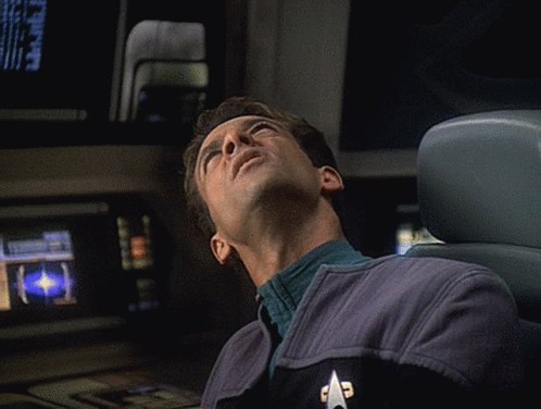 A Man Wearing A Purple Jacket With A Star On It GIF