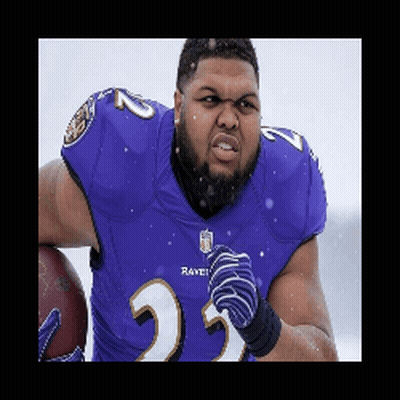 A Man Wearing A Purple Ravens Jersey Is Holding A Football GIF