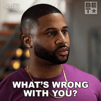 A Man Wearing A Purple Shirt Says What 'S Wrong With You GIF