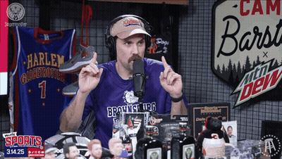 A Man Wearing A Purple Shirt That Says Brownsville Ufc Talks Into A Microphone GIF