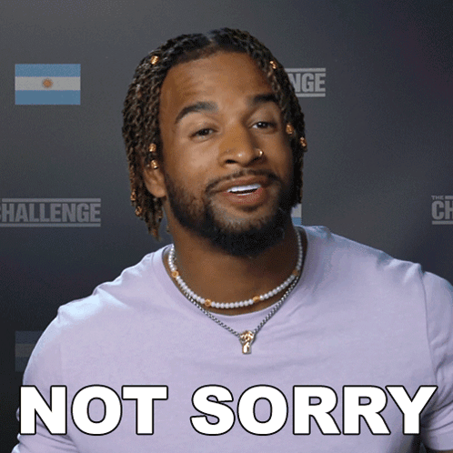 A Man Wearing A Purple Shirt With The Words Not Sorry On It GIF