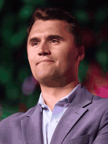 A Man Wearing A Purple Suit And A White Shirt GIF