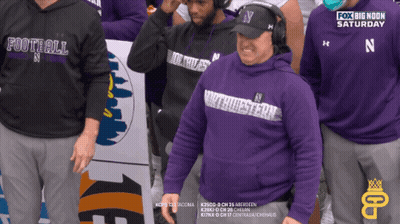A Man Wearing A Purple Sweatshirt That Says Football On It GIF