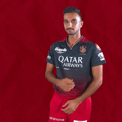 A Man Wearing A Qatar Airways Shirt Holds His Hands Together GIF