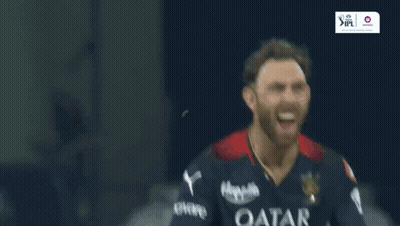 A Man Wearing A Qatar Airways Shirt Is Laughing GIF