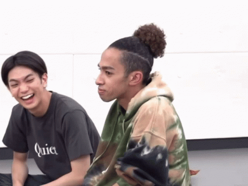 A Man Wearing A Quiet T-Shirt Is Laughing Next To Another Man GIF