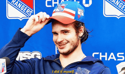 A Man Wearing A Rangers Hat And A Chase Jacket GIF