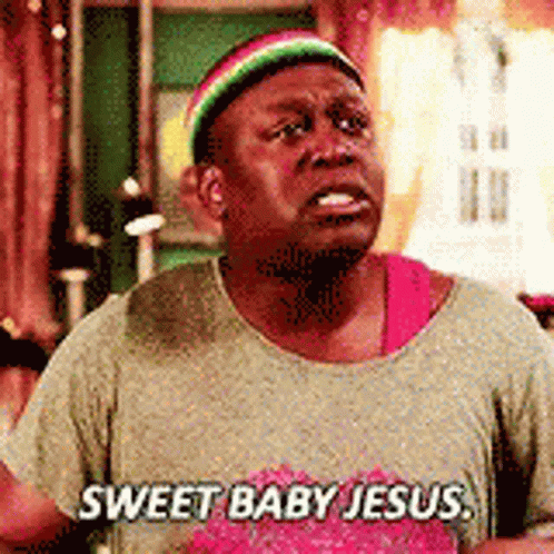 A Man Wearing A Rasta Hat And A T-Shirt That Says `` Sweet Baby Jesus '' Is Crying . GIF