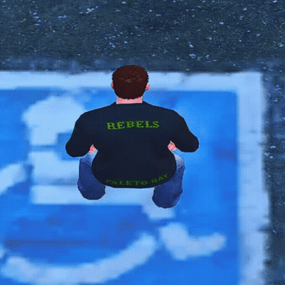 A Man Wearing A Rebels Shirt Is Squatting Down In Front Of A Handicapped Sign GIF