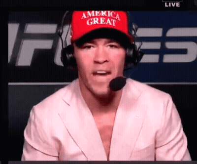 A Man Wearing A Red America Great Hat And Headphones GIF