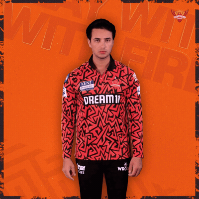 A Man Wearing A Red And Black Jersey That Says Dream On It GIF