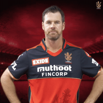 A Man Wearing A Red And Black Jersey With Exide And Muthoot Fincorp On It GIF