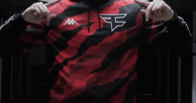 A Man Wearing A Red And Black Kappa Hoodie Points At Himself GIF
