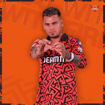 A Man Wearing A Red And Black Shirt That Says Dream11 On It GIF