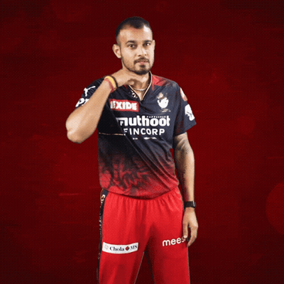 A Man Wearing A Red And Black Shirt That Says Exide On It GIF