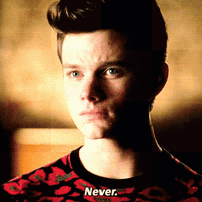A Man Wearing A Red And Black Shirt That Says Never GIF