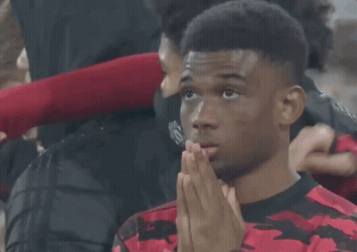 A Man Wearing A Red And Black Shirt With The Number 19 On The Front GIF