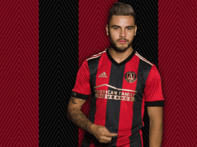 A Man Wearing A Red And Black Striped Shirt That Says American Family Insurance GIF