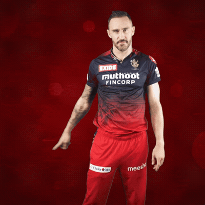 A Man Wearing A Red And Blue Shirt That Says Exide Muthoot Fincorp GIF