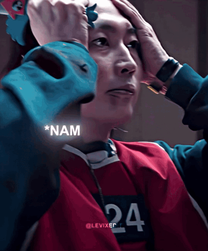 A Man Wearing A Red And Blue Shirt With The Number 24 On It GIF