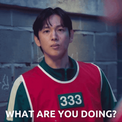 A Man Wearing A Red And Green Vest With The Number 333 On It Says What Are You Doing GIF